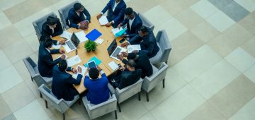 top view of team work high five a group of successful afro americans, europeans ,arabic and korean businessman and businesswoman working.